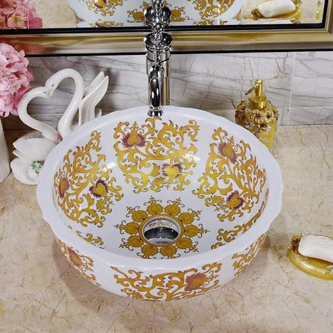 Slick White Ceramic Vessel Sink For Above Counter Bathroom Vanity With Top Shelf Glossy Glaze And Dead Simple Cleanup Round Art Bowl Shape Durable Porcelain, decorated with gold patterns.