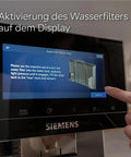 Top Shelf Six Pack Replacement Water Filter Cartridges Compatible With Siemens And Brita Intenza displayed on coffee machine screen.