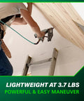 Worker using a Finish Nailer With Air Duster For Molding And Cabinetry on a ladder, demonstrating easy maneuverability, 3.7 lbs