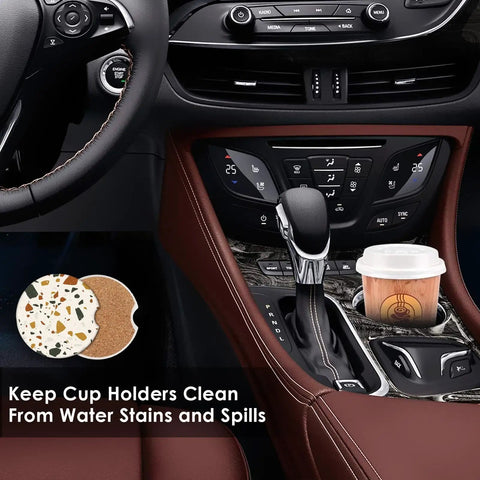 Car interior with Colorful Marble Cork Base Car Coasters Set 2 Pack in cup holder next to coffee cup.