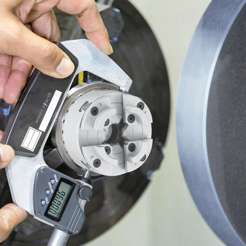 Four Jaw Lathe Chuck Three Point Seven Five Inch Diameter Self Centering Tool For Lathe And Milling Machines being measured
