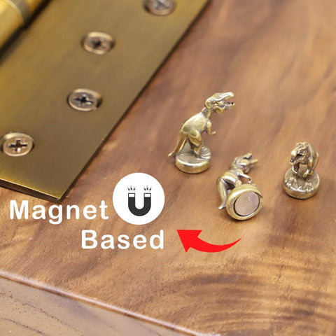 Magnetic Hinge Head T Rex Set Of 3 Miniature Door Topper Figures For Standard Hinges in copper on wood surface.