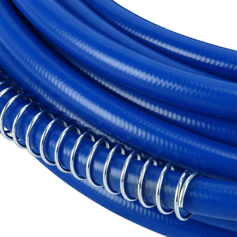 Close-up of blue coiled hose part of 65 Ft Airless Spray Gun Hose Kit With 8 Inch Extension Pole Tip Guard 517 Tip 3600 Psi Max 1 Quarter Inch Airless Paint Spray Hose Blue 20 Meter For Primers Stains Varnishes Latex DIY
