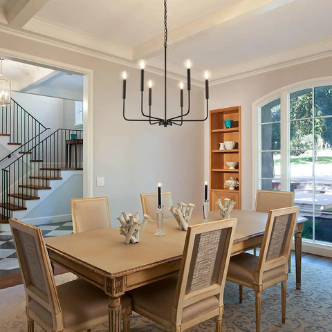 Premium Black Six Light Chandelier Rust Resistant Metal Candle Pendant Fixture For Dining Room Kitchen Modern Farmhouse Ceiling Lamp above a dining table.
