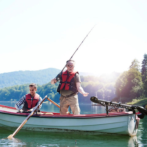Two people fishing on a boat with trolling motor stabilizer mount for Terrova Riptide Ulterra PowerDrive attached to rail.