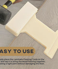 Hands using 4-in-1 Nylon Tapping Block Kit For Laminate And Wood Flooring Installation with rubber mallet on wooden floor