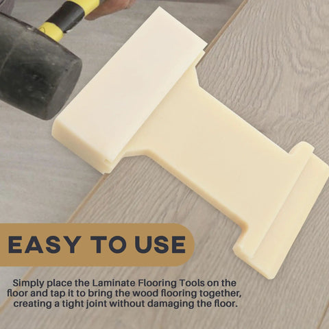Hands using 4-in-1 Nylon Tapping Block Kit For Laminate And Wood Flooring Installation with rubber mallet on wooden floor