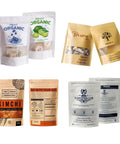 Assorted custom print kraft paper bags with window stand up zipper lock pouch for snacks, tea, coffee reusable packaging displayed