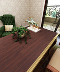 Slick Peel And Stick Countertop Wrap Featuring Sweet Dark Walnut Wood Grain on desk with plant and decor in elegant room.