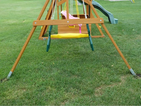 Top Shelf 18 Inch Aluminum Screw Earth Anchor Built Tough For 2500 Pound Loads Reusable Heat Treated Design securing a wooden swing set.
