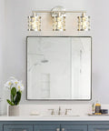 Three Light Brushed Nickel Vanity Light Fixture With Cylinder Crystal Shades Over Mirror Slick Modern Wall Sconce in bathroom