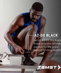 Athlete wearing A2 DX Sports Ankle Brace With Protective Guards For High Ankle Sprains And Chronic Instability, Black Right Small