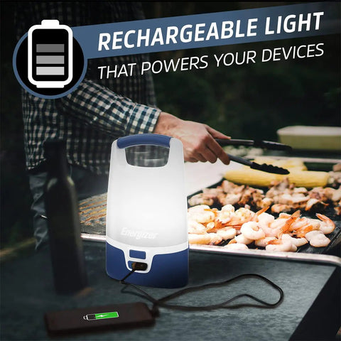 Smart Multi Color LED Lantern 1200 Lumen Rechargeable Camping Light For Indoor And Outdoor Use illuminating a barbecue grill area