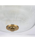 Bottom view of Vintage Brass Two Light Close To Ceiling Flush Mount Fixture In Archie Collection Style with prismatic glass.