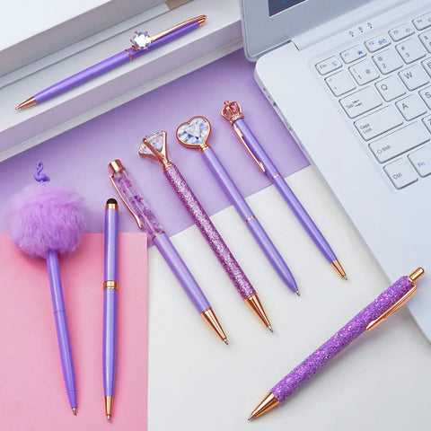 Purple Crystal Diamond Pens Set 8 Metal Pens In Different Styles With Black And Blue Ink For Journaling And Office Use For Women Glam Back To School Essentials And Girl Birthday Gift Idea on a desk with a laptop