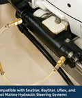 Close-up of One Person DIY Hydraulic Steering Bleed Kit With Filler Hose For SeaStar BayStar And Uflex Systems in use