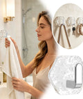Hella Strong 10 Pcs White Hexagonal Water Ripple Self Adhesive Wall Hooks, heavy duty grip holding towel in bathroom.