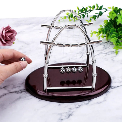 Newton Cradle Desk Toy With Clinking Pendulum Balls Calming Stress Relief For Home Office Decor Educational Gift shown on marble surface
