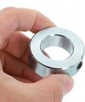 Close-up of a silver carbon steel set-screw shaft collar with 15/16 in bore and 1-5/8 in OD
