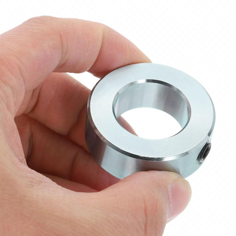 Close-up of a silver carbon steel set-screw shaft collar with 15/16 in bore and 1-5/8 in OD
