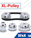 Rock Solid Aluminum XL Timing Pulley Featuring 20 Dope Teeth And Five Point Zero Eight Mm Pitch Slick Action For Ten Mm XL Belts Smooth As Butter Transmission For Hot Rod CNC Projects And Daily Shop Work You Are Going To Adore with multiple pulleys and a black belt.