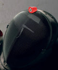 Beefy Heavy Duty Stainless Steel Nut Replacement Tool with Plastic Ring on a black fencing mask