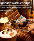 Rechargeable Portable Mushroom LED Table Lamp With Touch Sensor on a living room table next to guitar and cozy seating.
