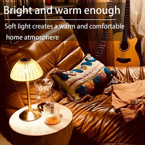 Rechargeable Portable Mushroom LED Table Lamp With Touch Sensor on a living room table next to guitar and cozy seating.