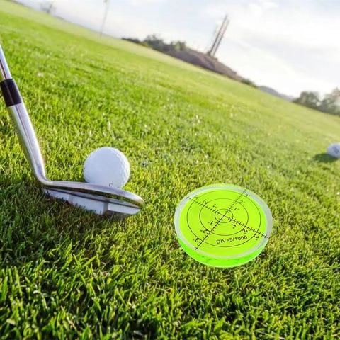 66mm Circular Bubble Spirit Level With Degree Marked Surface, Round Acrylic Level Tool For Precise Layouts And Measuring, Non Sticky 10mm Thick, 2.59 Inch Diameter. on golf grass beside club and ball