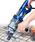 Heavy Duty Electric Rebar Cutter With 900W Pure Copper Motor cuts steel rods with ease in a construction setting.