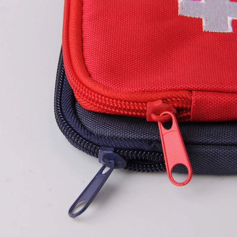 Close-up of red and blue bags from Two Pack Grab And Go First Aid Bag Portable Medical Kit, showcasing zippers and durable 600D Oxford cloth.