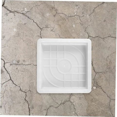 DIY Concrete Molding Kit With 2 Piece Paver Molds For Patio Garden Pathway Cement Molds Plastic Paving Edging Forms on a cracked surface
