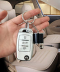 Dope 6 Speed Manual Shift Gear Keychain Solid Polished Metal Mini Transmission Knob Key Ring For Daily Cruises Cars Trucks And Hot Rods Black Style in hand inside car interior.