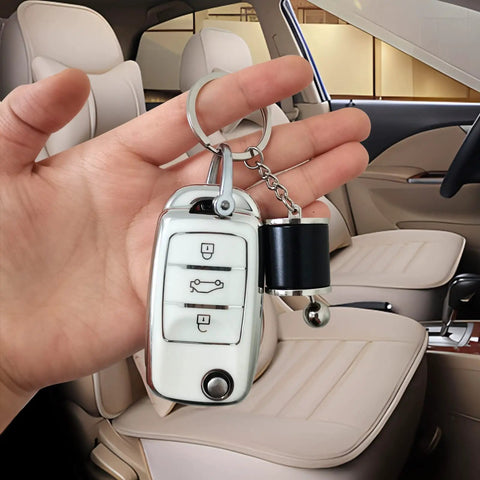 Dope 6 Speed Manual Shift Gear Keychain Solid Polished Metal Mini Transmission Knob Key Ring For Daily Cruises Cars Trucks And Hot Rods Black Style in hand inside car interior.