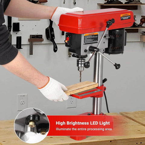8 Inch Benchtop Drill Press With Laser Guide And Led Light being used for wood drilling on a workbench with gloves on.