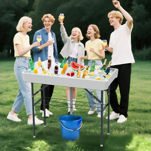 Folding Ice Cooler Table With Skirt And Drain Hose Portable Self Serving Beverage Bar For Parties Picnics Barbecues Outdoor Events White Keeps Drinks Cold On The Go filled with beverages at a picnic.