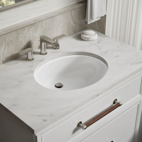 Oval Undermount Bathroom Sink White 17x14 Inch, Vitreous China, Overflow Drain, fits standard 14x17 cutout, marble countertop view