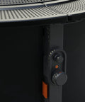 Infinity Flame Propane Fire Pit Outdoor Gas Table With Smokeless Signature Flame Design, close-up of control knob and perforated steel surface
