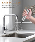 Person holding Rechargeable Milk Frother With USB, Portable Handheld Whisk, Silver, next to running kitchen faucet.