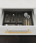 Top Shelf Solid Brass Cabinet Pulls Featuring Slick Brushed Gold Finish on a white drawer with cutlery organizers inside.