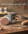 Heavy Duty Aluminum Oxide Sanding Discs With Flexible Backing For Tough Cutting And Smooth Finishes On Wood Metal Or Paint That Resist Tearing And Conform Perfectly To Weird Shapes Without Gunking Up Your Drill Today near a power sander with multiple grit discs.