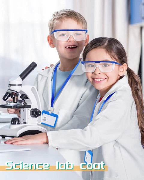 Children wearing Six Set Of White Kids Lab Coats With Goggles And ID Card Holders, using a microscope, smiling.