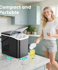 Woman using Countertop Ice Maker With Handle Auto Clean Portable Ice Maker 26 Lbs In 24 Hours 9 Ice Cubes In 6 Minutes Two Ice Cube Sizes Includes Basket And Scoop Party Ready For Home Camping Or RV Black in kitchen.