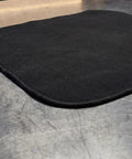 Close-up of a black 2 Pack Tough Fireproof Mat With High Heat Resistant Carbon Felt Blanket for welding and grill use.