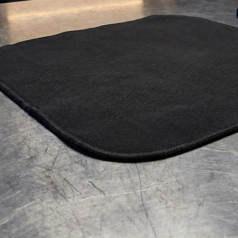 Close-up of a black 2 Pack Tough Fireproof Mat With High Heat Resistant Carbon Felt Blanket for welding and grill use.