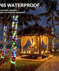 Solar Rope Lights 40 Ft 120 LEDs Multi Color Fairy Lights With 8 Modes illuminating palm trees and a gazebo in the rain
