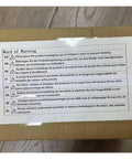 Package with multilingual safety warning label on a cardboard box.