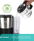 Replacement Glass Carafe For Ninja Coffee Maker 12 Cup pouring water into reservoir, showing ergonomic handle and spout design