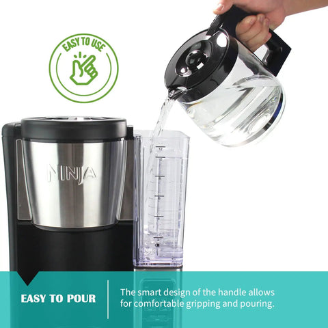 Replacement Glass Carafe For Ninja Coffee Maker 12 Cup pouring water into reservoir, showing ergonomic handle and spout design