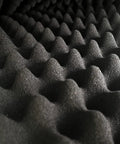 Close-up of Egg Crate Acoustic Foam Panel 48 By 24 By 2 Inches Black Dope Soundproof Studio Foam, highlighting egg crate texture.